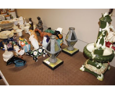A pair of Art Deco candlesticks on marble and onyx bases 