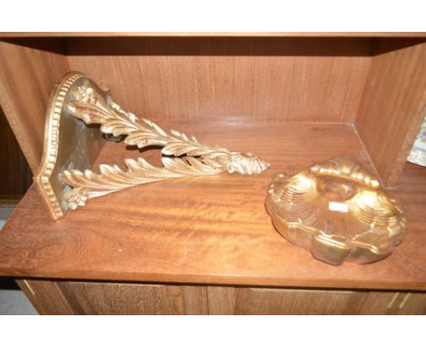 A decorative gilt wall bracket in the form of a shell; and another gilt wall bracket having foliate decoration