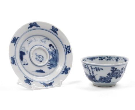 A Chinese blue and white tea bowl, Qianlong, decorated with flowers, bamboo, and rockwork, 7.5cms; and a small Kangxi style s