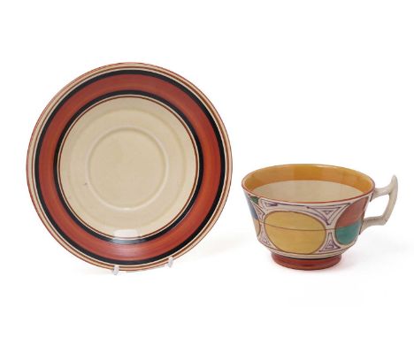A Clarice Cliff Fantasque Bizarre ‘Picasso’ or ‘Melon pattern’ teacup and saucer, circa early/mid 1930s, decorated with geome