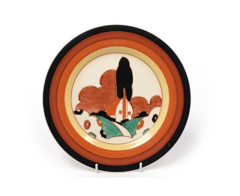 A Clarice Cliff Bizarre ‘Farmhouse’ pattern plate, circa early 1930s, decorated with a cottage amidst a garden of trees and b