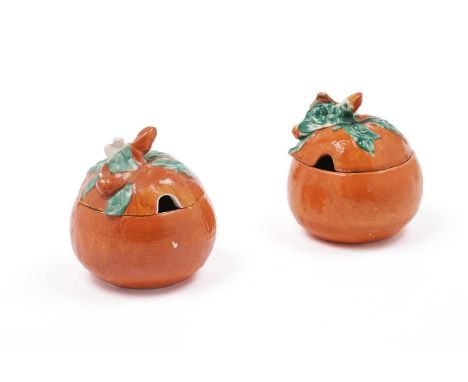 A Clarice Cliff ‘Orange’ preserve jar and cover, circa early-mid 1930s, the cover’s finial modelled as a flowering stem, make