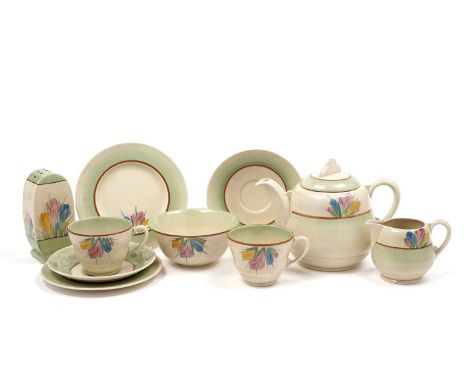 A late 1930s Clarice Cliff ‘Spring Crocus’ pattern tea service, decorated with crocuses in pink, yellow, and blue, with pale 