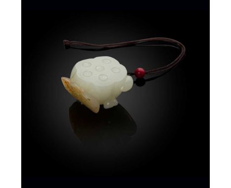 WHITE JADE WITH RUSSET SKIN 'LOTUS' PENDANT QING DYNASTY, 19TH CENTURY 清 白玉帶皮巧雕蓮蓬荷葉吊墜 carved in the round as a lotus pod with