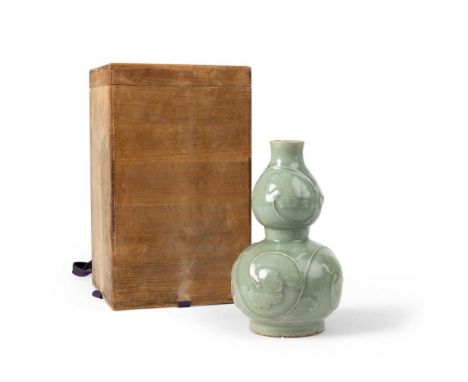 LONGQUAN CELADON RELIEF-DECORATED DOUBLE-GOURD VASE YUAN DYNASTY OR LATER  元或以後 龍泉青釉貼花葫蘆瓶 finely potted with a globular lower