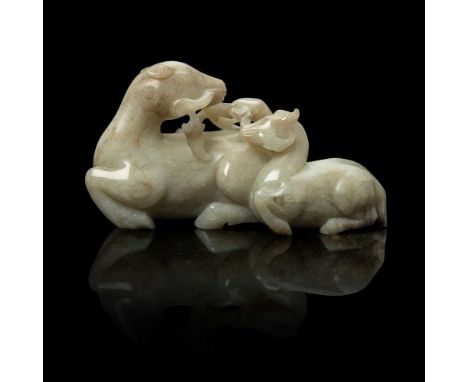 GREYISH WHITE JADE CARVING OF MOTHER HORSE AND FOAL  QING DYNASTY, 19TH CENTURY 清 青花玉雕瑞馬攜子擺件 carved in the round with a recum