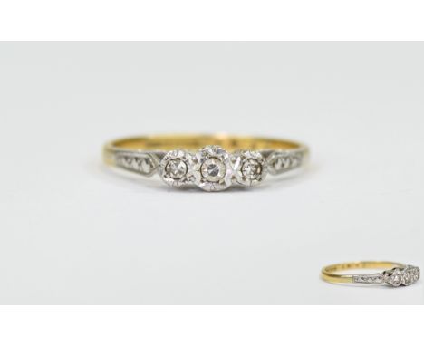 18ct Yellow Gold and Platinum Three Stone Diamond Illusion Set Ring marked 18ct and platinum. Ring size P. 2.75 grams.