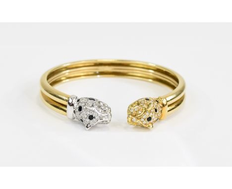 A Superb 18ct Gold Leopards Head Bangle, the leopards head in 18ct white and yellow gold set with diamonds and sapphires. Mar