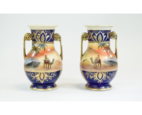 Noritake Hand Painted and Encrusted Pair of Twin Handle Vases. c.1920. Painted Arabian Desert Landscapes with Figures. c.1920