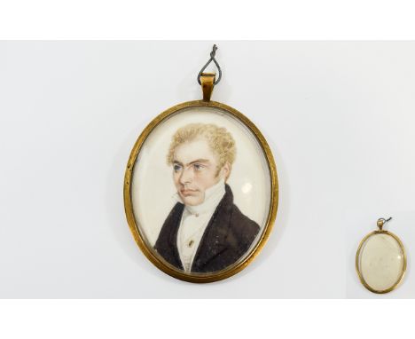 Hand Painted Portrait Miniature of a young gentleman with light coloured complexion, curly hair, black jacket and whtie shirt