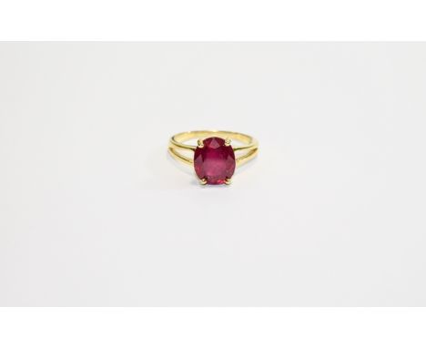 Ruby Solitaire Ring, a rich red oval cut ruby of 6.5cts set on a split-shouldered band of 14ct gold vermeil and silver; the r