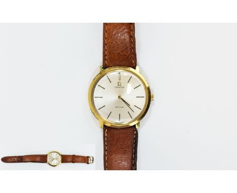 Omega De Ville Manual Wind Gold Plated Wrist Watch circa 1970. Attached to a tan leather strap. Excellent condition in all as