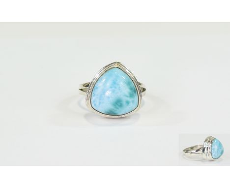 Larimar Trillion Cut Ring, a 6.8ct trillion cut cabochon of the mottled sea blue stone found only in the Dominican Republic, 