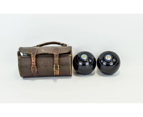 Vintage Bowling Balls Housed in original brown leather cylindrical case with double buckle fastening and top handle. Interior