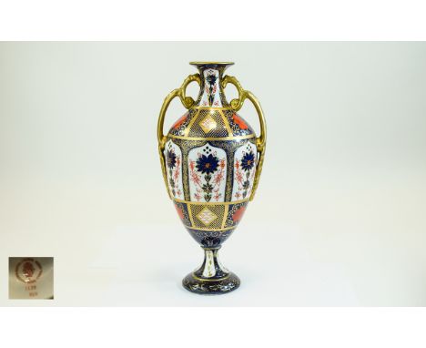 Royal Crown Derby Imari Pattern Twin Handle Urn Shaped Vase. Pattern No 1128, Date 1973. Stands 10.75 Inches High. 