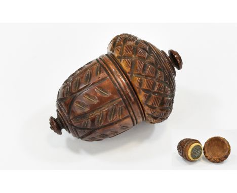 A Superb German Carved Coqvilla Nutmeg Grater of acorn form, the screw off lid with notched edge, above a diagonal diapering 