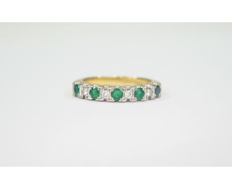 18ct Gold Set Emerald and Diamond Dress Ring set with 5 emeralds interspaced with 4 round cut diamonds both diamonds and emer