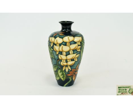 Moorcroft Collectors Club Modern Tubelined Vase. 'Yellow Wisteria' design. Designer Phillip Gibson, circa 1990's. 6.5 inches 