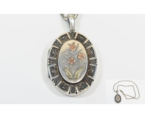 A Very Nice Quality and Vintage Oval Shaped Hinged Locket with raised floral decoration to central panel amd enameled floral 