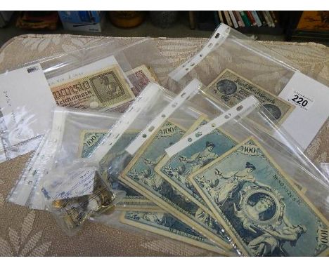 A selection of vintage foreign banknotes and coins