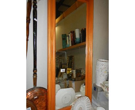 A pine framed mirror, 47cm x 112cm