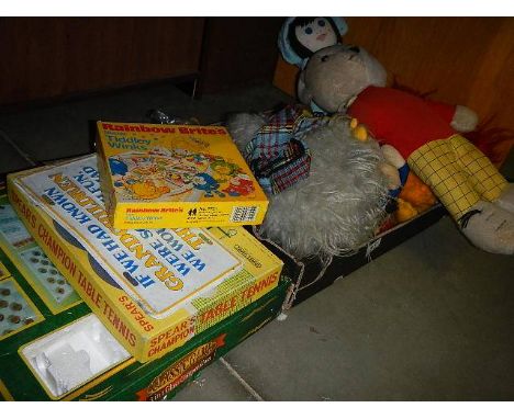 A quantity of soft toys including vintage Rupert, Womble etc plus games and a soft guitar case