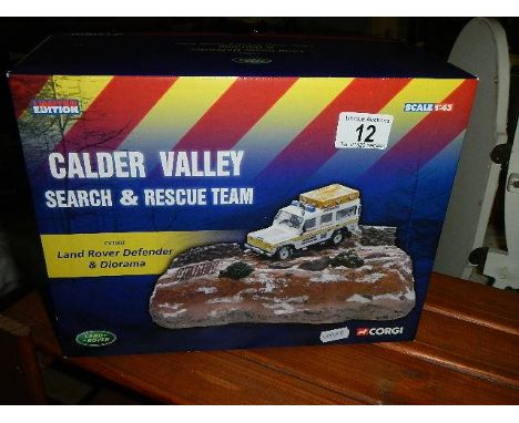 A boxed Corgi CV1002 Ltd Ed Calder Valley search and rescue team Land Rover Defender and Diorama