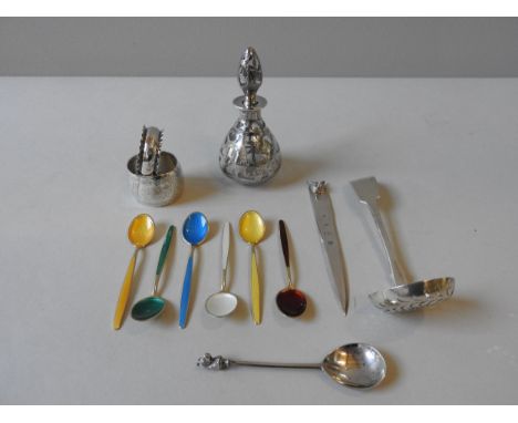 A SILVER LETTER OPENER, SILVER SIFTING SPOON AND A SILVER OVERLAID SCENT BOTTLE, the letter opener decorated with a fox's hea