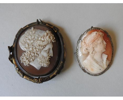A VICTORIAN PINCHBECK REVOLVING CAMEO MOURNING BROOCH, depicting a Greco-Roman god, along with another oval portrait cameo br