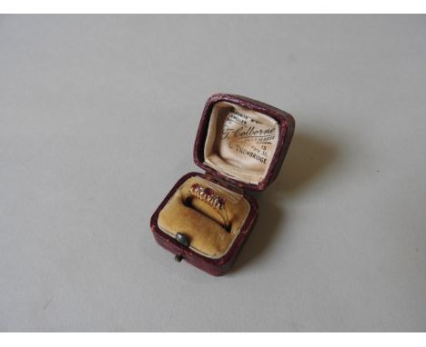 A LATE 19TH CENTURY 18CT GOLD RUBY AND DIAMOND SET RING Three pink rubies and two smaller diamonds claw set to a tapered shan