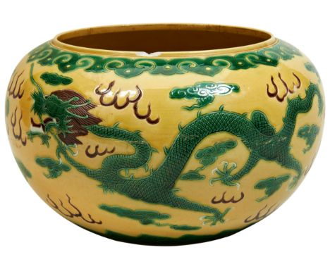 A GREEN AND AUBERGINE ENAMELLED YELLOW-GROUND JARDINIERE KANGXI MARK, 19TH / 20TH CENTURY the sides decorated with dragons ch