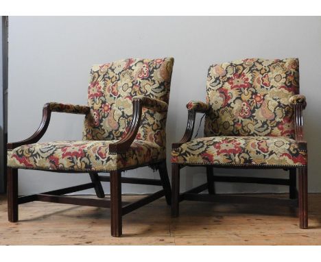 A NEAR PAIR OF GEORGIAN 'GAINSBOROUGH' MAHOGANY ARMCHAIRS, tapestry back panel and seat panel, with down swept arm supports, 