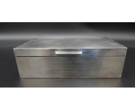 A SILVER ENCASED WOODEN CIGARETTE BOX, Birmingham 1955, with an engine turned lid and presentation inscription, 5 x 16.5 x 8.