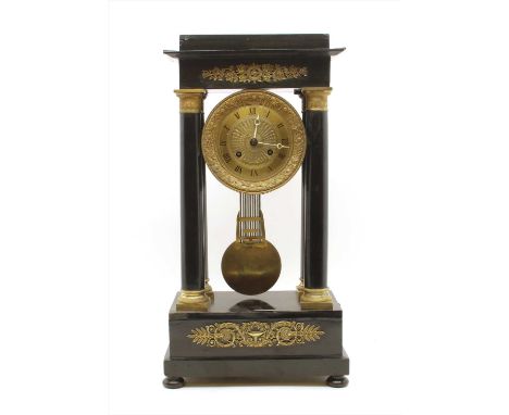 A 19th century Empire portico clock , ebonised gilt mounted, 55cm high x 29cm wide