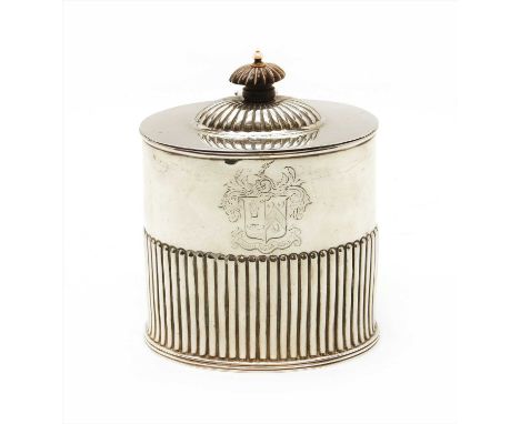 A late Victorian silver tea caddy by Mappin &amp; Webb, of ovoid form with half reeded body and ebony finial, Sheffield 1890,