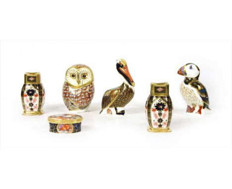 Three Royal Crown Derby paperweights , brown pelican, puffin and an owl, boxed; a Royal Worcester Connoisseur Collection pot 