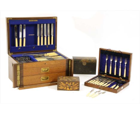 An oak canteen of silver plated cutlery, together with a cased set of fish knives and forks, a penwork style box and a lacque