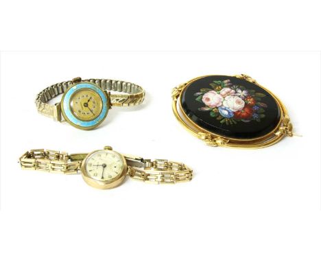 A gold micro mosaic brooch, depicting a bouquet of flowers, cracks to the panel, rub set to frame with ribbon motifs at the c