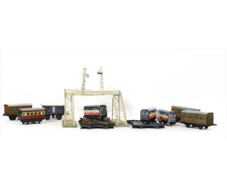 Eleven Marx Tin 'O' gauge railway goods wagons, inscribed 'State of Maine Products', eight Hornby 'O' gauge tin passenger car