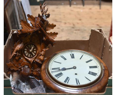 2 clocks. An early 20th century English round dial timepiece in a mahogany case. Together with a modern Black Forest cuckoo c