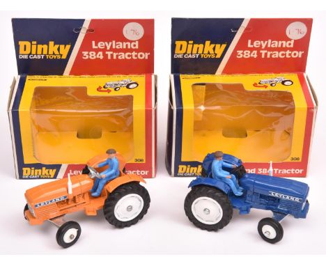 2x Dinky Toys Leyland 384 Tractor (308). One example in dark blue, the other in orange. Both with white wheels and light blue