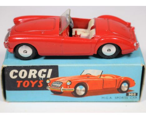 Corgi Toys M.G.A. Sports Car (302). In bright red with cream seats, smooth spun wheels and complete with screen. In early blu