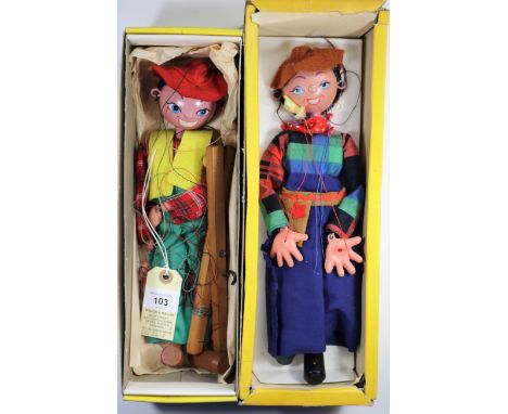 2 Pelham Puppets. Both Standard examples and both look to be variations of the Cowboy and Cowgirl. One with light green flare