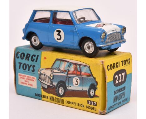 Corgi Toys Morris Mini-Cooper Competition Model (227). An example in mid blue with white roof and bonnet, with crossed flags 