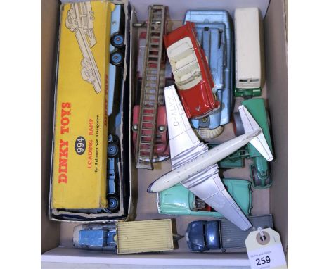 12 Dinky Toys. Pullmore Car Transporter and loading ramp, both in well worn/damaged boxes. Plus a Bedford Turntable Fire Esca