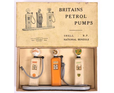 A scarce Britains Petrol Pumps set 101V. 3-pump set; Shell, B.P. and National Benzole. On a grey base. Boxed with inner packi
