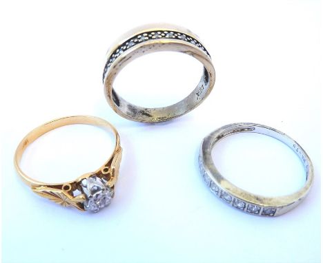 Three rings: a diamond set ring stamped 18ct; a 9-carat diamond-set half hoop ring; a diamond-set half hoop ring&nbsp;&nbsp;(