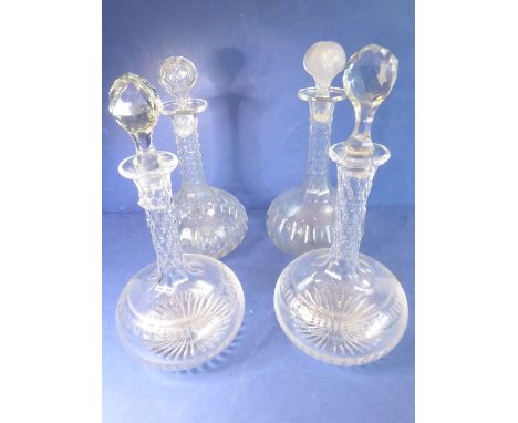 Two pairs of late 19th century globe-and-shaft decanters