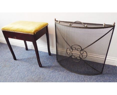 An early 20th century stained wood music/piano stool with hinged upholstered lid, together sheet music within and a bow-front