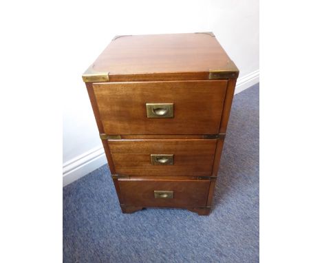 A small mahogany and brass-mounted campaign-style three-drawer chest; recessed brass handles, raised on shaped bracket feet (